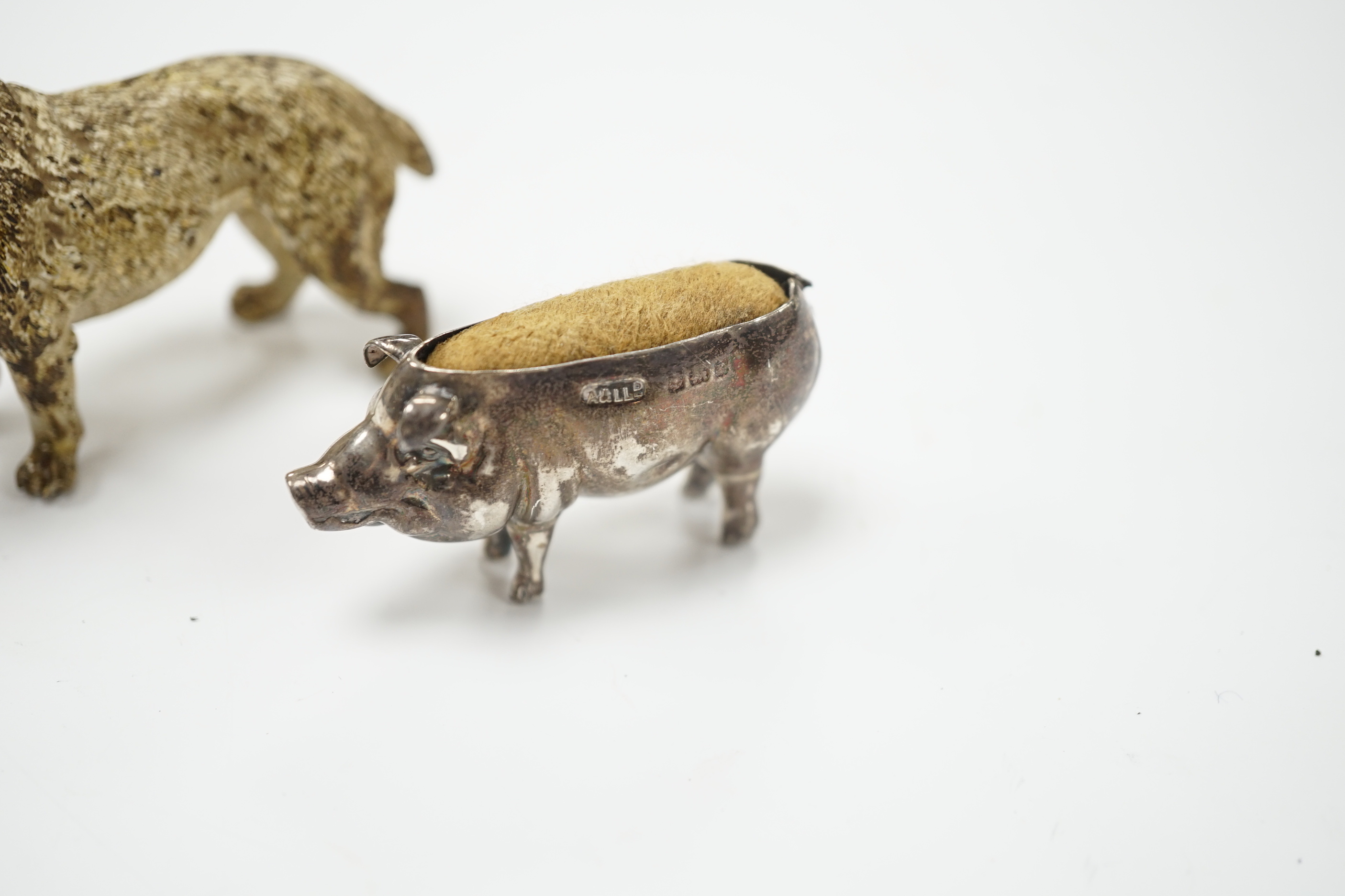 An Austrian cold painted dog, silver pig pin cushion, Adie & Lovekin, largest 6.5cm wide